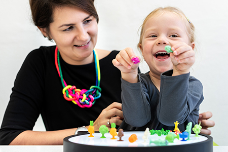 Therapist working with child