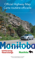 2010 Official Highway Map - car driving by trees and rock cliff