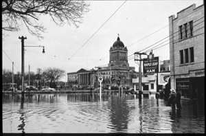 View of the Manitoba Legislative Building seen from the flooded  Broadway street in , Winnipeg, 1950.