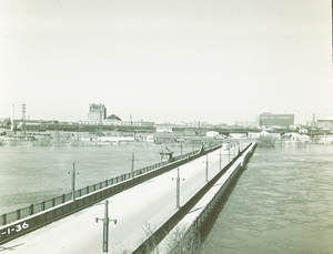 Flood waters almost reaching the height of the old Provencher Bridge, 1950