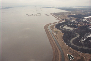 Aerial image looking southwest showing flooding along West Dike, 1997
