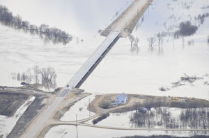 Aerial image showing high flows under the St. Adolphe Bridge, 2011