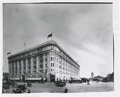 photo with Hudson's Bay Company building with Legislative Building in background